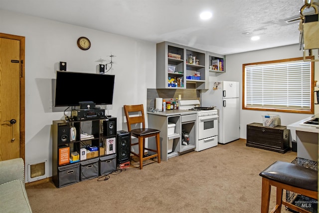 kitchen with white appliances, light colored carpet, and open shelves