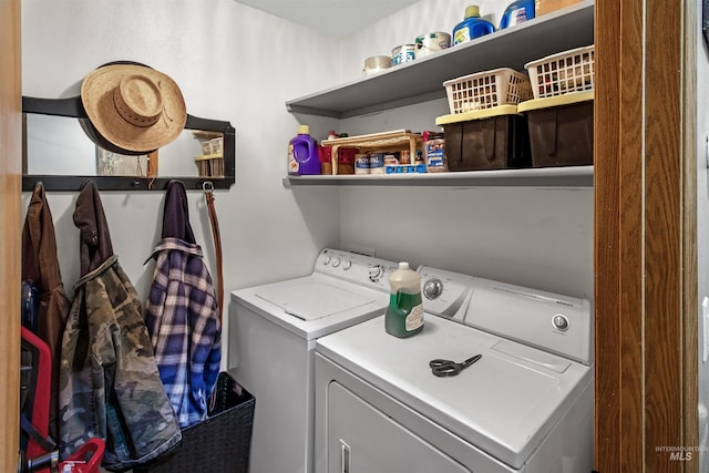 laundry area with washer and clothes dryer and laundry area