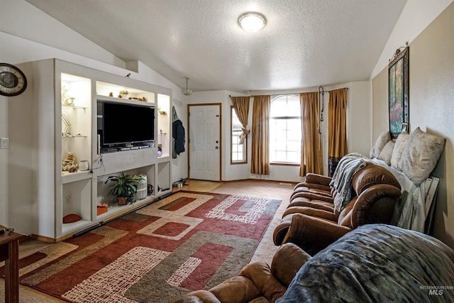 carpeted living room with a textured ceiling, baseboards, and vaulted ceiling
