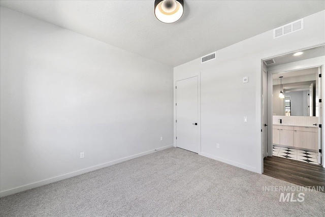 unfurnished bedroom featuring carpet flooring