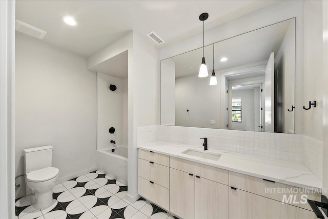 full bathroom with vanity, toilet, and washtub / shower combination