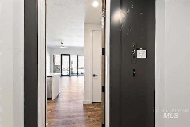 hallway featuring a textured ceiling