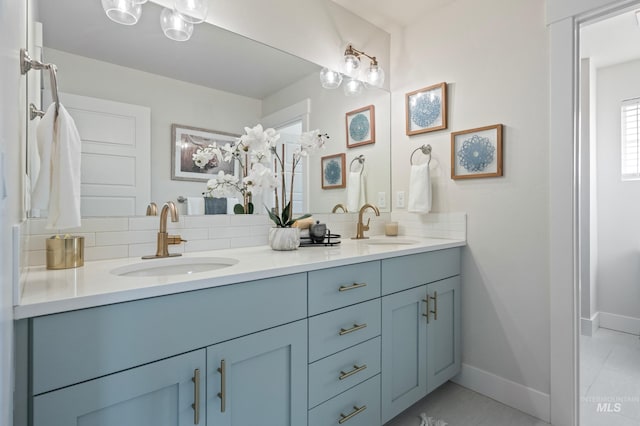 bathroom with vanity, tile patterned flooring, and decorative backsplash