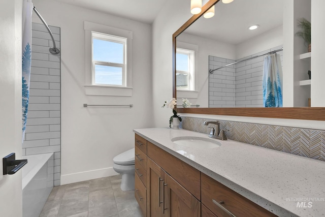 20138 Carbondale Ave, Caldwell, ID 83605 - full bathroom featuring baseboards, decorative backsplash, toilet, tile patterned floors, and vanity