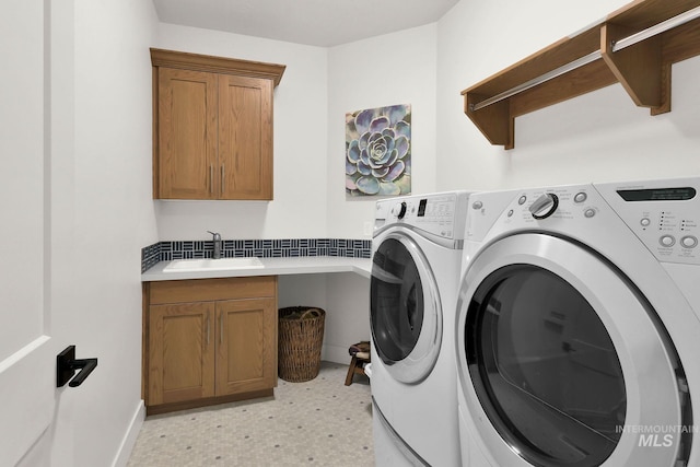 20138 Carbondale Ave, Caldwell, ID 83605 - laundry room featuring light floors, washing machine and dryer, cabinet space, and a sink