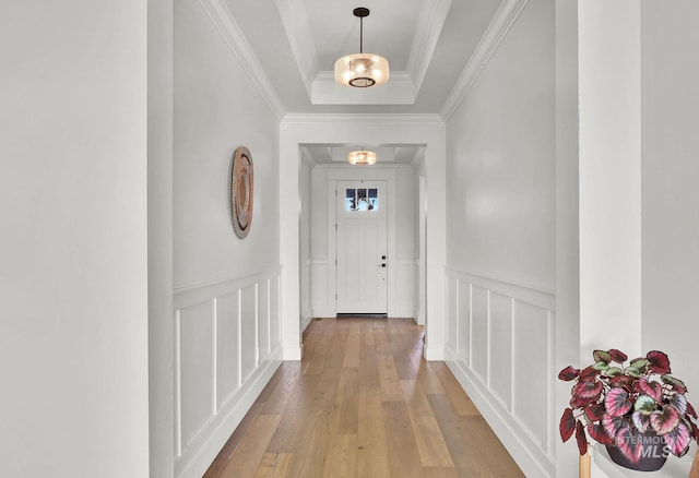 20138 Carbondale Ave, Caldwell, ID 83605 - entryway featuring a wainscoted wall, hardwood / wood-style floors, a tray ceiling, crown molding, and a decorative wall