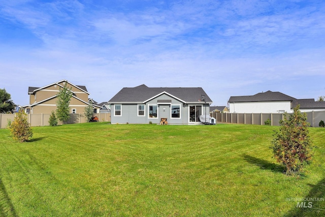 20138 Carbondale Ave, Caldwell, ID 83605 - rear view of property with a fenced backyard and a yard