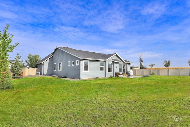20138 Carbondale Ave, Caldwell, ID 83605 - back of house featuring a patio, a lawn, a fenced backyard, and a gate