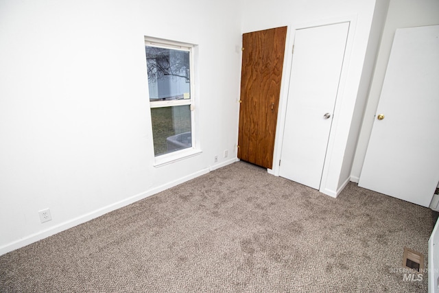 unfurnished bedroom with light carpet