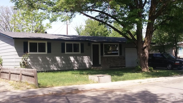 ranch-style home with a garage