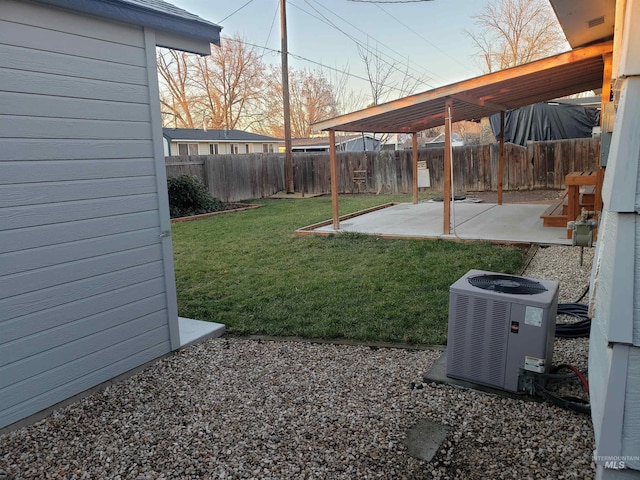 view of yard with a patio area and central air condition unit