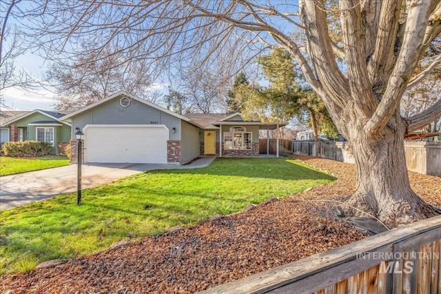 single story home featuring a front lawn and a garage