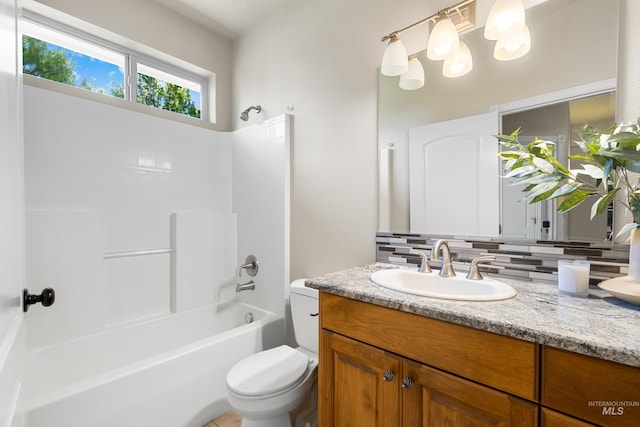 12258 Whitechapel Way, Nampa, ID 83686 - bathroom with vanity, tasteful backsplash, toilet, and  shower combination