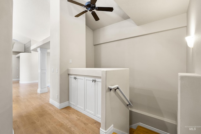 12258 Whitechapel Way, Nampa, ID 83686 - corridor featuring light wood-style floors, high vaulted ceiling, ornate columns, and baseboards