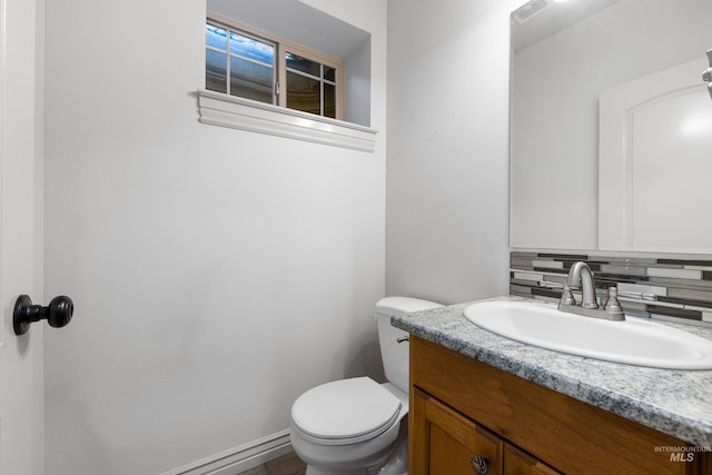 12258 Whitechapel Way, Nampa, ID 83686 - bathroom with vanity, toilet, and backsplash