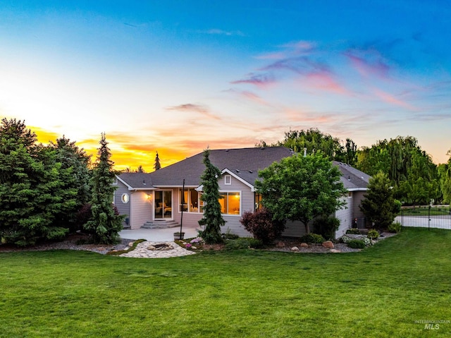 12258 Whitechapel Way, Nampa, ID 83686 - back of house at dusk featuring a patio area