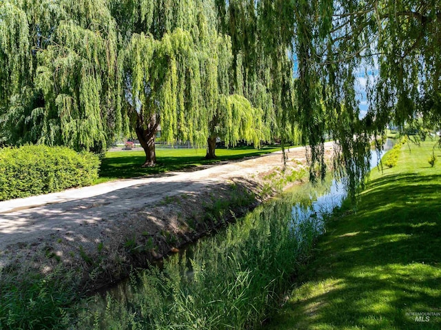 12258 Whitechapel Way, Nampa, ID 83686 - view of community featuring a water view and a lawn