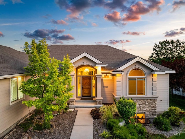 12258 Whitechapel Way, Nampa, ID 83686 - view of front of home with stone siding and a shingled roof