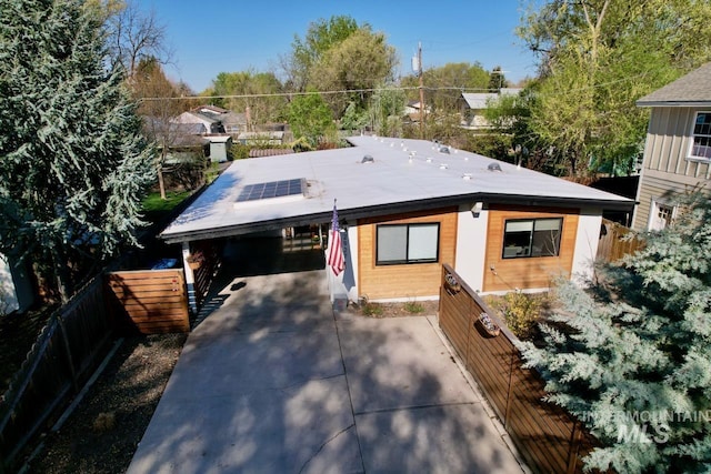 2927 N 32nd St, Boise, ID 83703 - view of front facade with fence, a carport, and concrete driveway