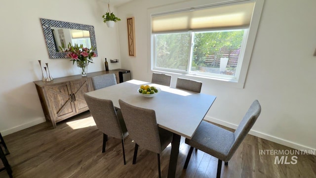 2927 N 32nd St, Boise, ID 83703 - dining space featuring baseboards and dark wood-style floors