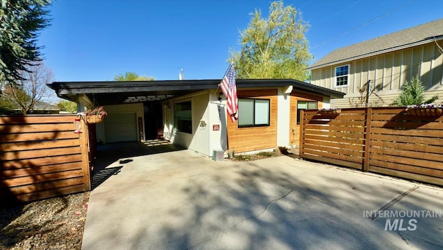 2927 N 32nd St, Boise, ID 83703 - view of front of house featuring fence, a carport, and driveway