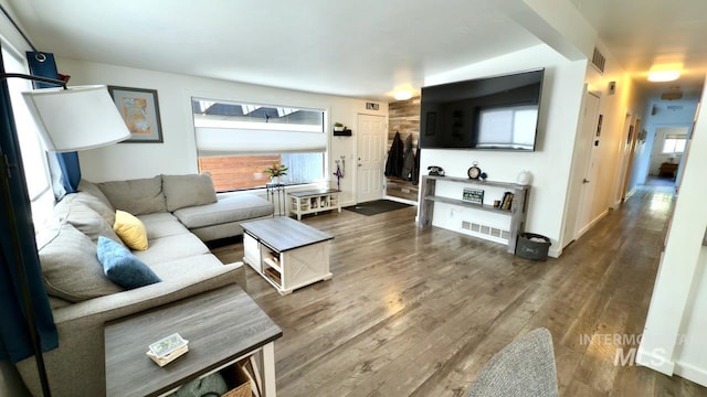 2927 N 32nd St, Boise, ID 83703 - living room featuring wood finished floors, visible vents, and baseboards