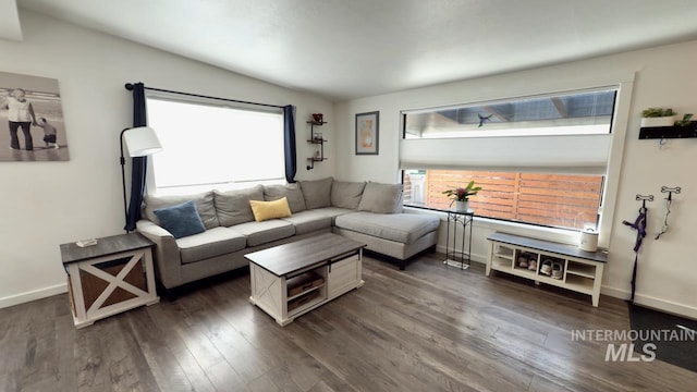 2927 N 32nd St, Boise, ID 83703 - living room featuring baseboards, vaulted ceiling, and dark wood-type flooring