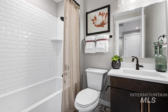 full bath with visible vents, shower / bath combination with curtain, toilet, and vanity