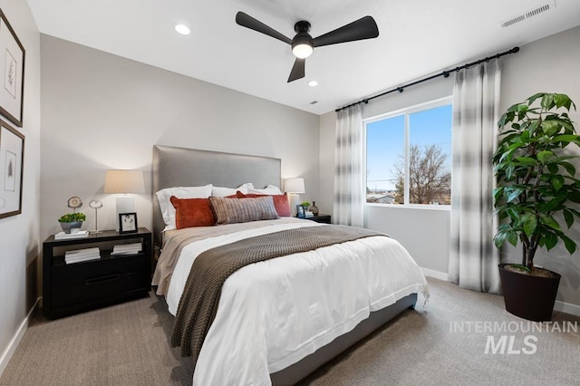 carpeted bedroom featuring a ceiling fan, recessed lighting, baseboards, and visible vents