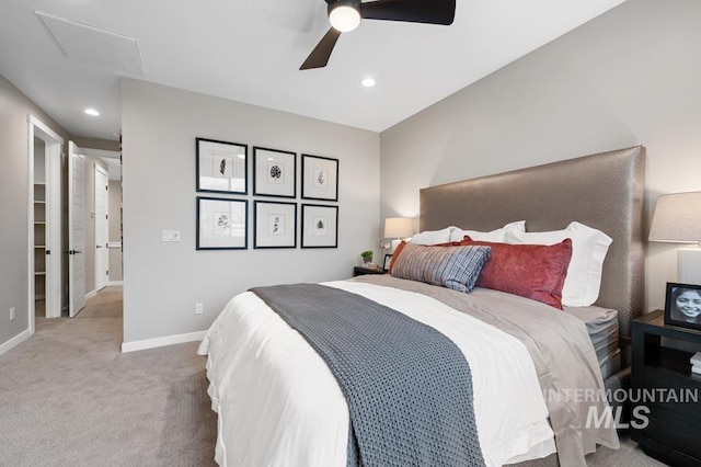 carpeted bedroom featuring attic access, recessed lighting, baseboards, and ceiling fan