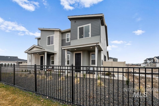 view of front of house featuring fence private yard