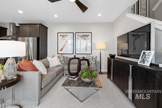 living room featuring recessed lighting, baseboards, and a ceiling fan