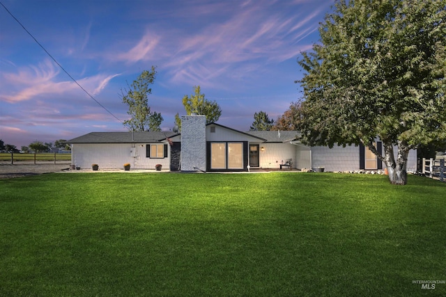 11457 S Cloverdale, Kuna, ID 83634 - rear view of house with a yard