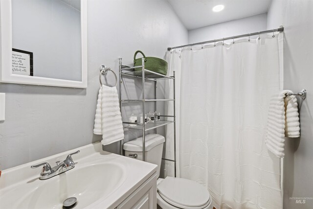 11457 S Cloverdale, Kuna, ID 83634 - full bathroom with a shower with shower curtain, vanity, and toilet