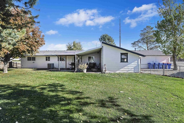 11457 S Cloverdale, Kuna, ID 83634 - back of house featuring central AC unit, fence, a patio, and a yard