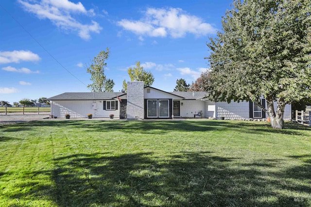 11457 S Cloverdale, Kuna, ID 83634 - back of house with fence and a lawn