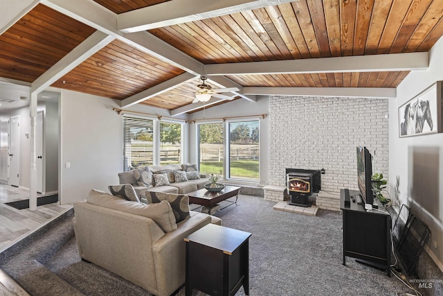 11457 S Cloverdale, Kuna, ID 83634 - carpeted living room featuring wooden ceiling, a wood stove, lofted ceiling with beams, and a ceiling fan