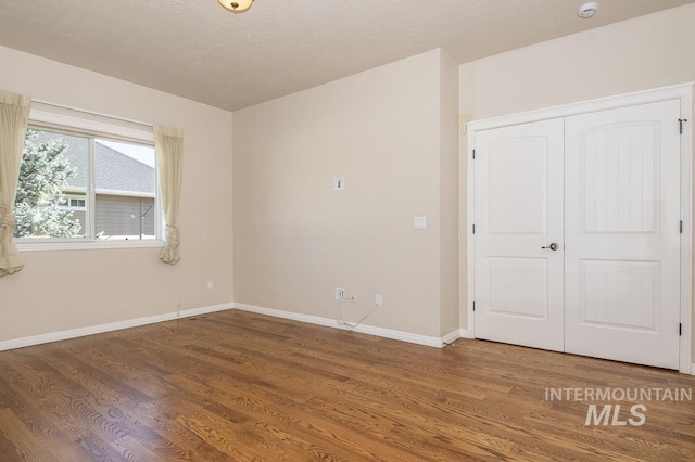 325 S Whisperwood Way, Boise, ID 83709 - spare room featuring baseboards and wood finished floors
