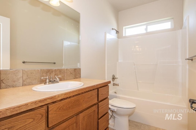 325 S Whisperwood Way, Boise, ID 83709 - full bathroom with shower / tub combination, tile patterned flooring, vanity, toilet, and decorative backsplash