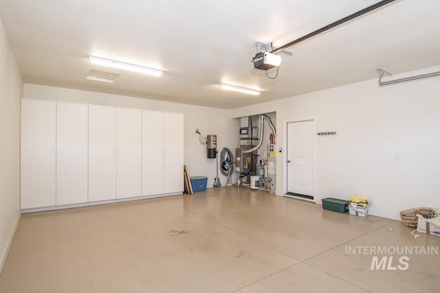 325 S Whisperwood Way, Boise, ID 83709 - garage with baseboards and a garage door opener