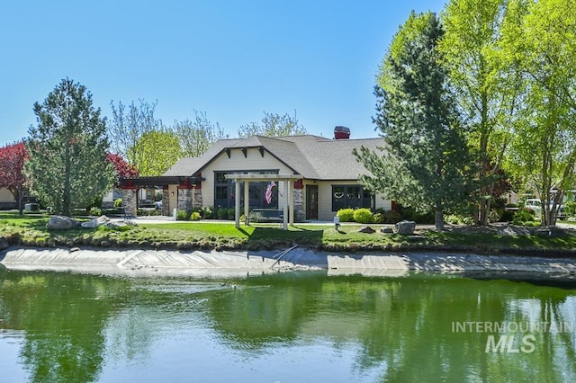 325 S Whisperwood Way, Boise, ID 83709 - rear view of house with a water view and a chimney