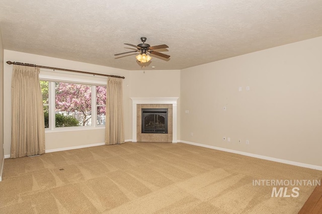 325 S Whisperwood Way, Boise, ID 83709 - unfurnished living room with a ceiling fan, baseboards, light carpet, and a textured ceiling