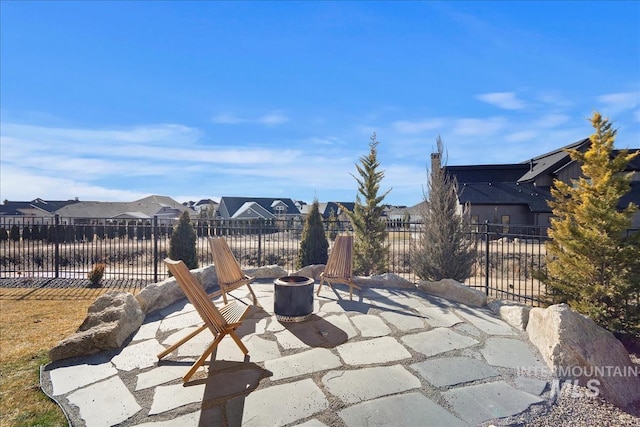 view of patio / terrace featuring an outdoor fire pit