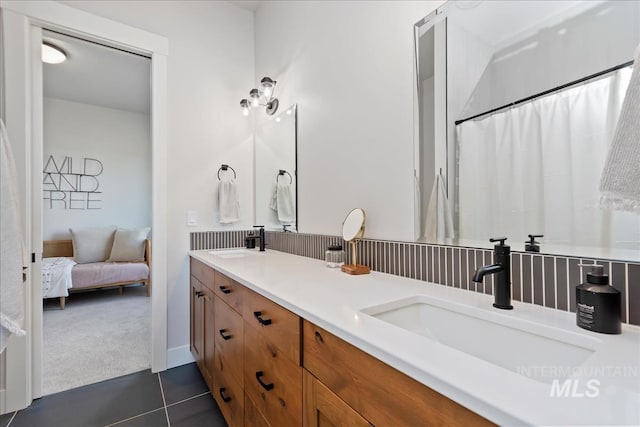 bathroom with vanity and tile patterned flooring