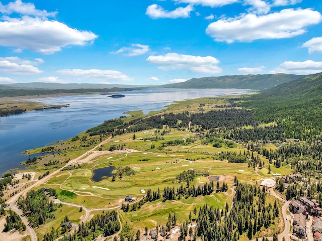 drone / aerial view featuring a water and mountain view