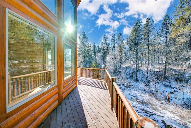 view of snow covered deck