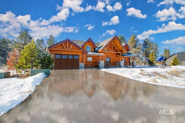 log-style house featuring a hot tub and central air condition unit