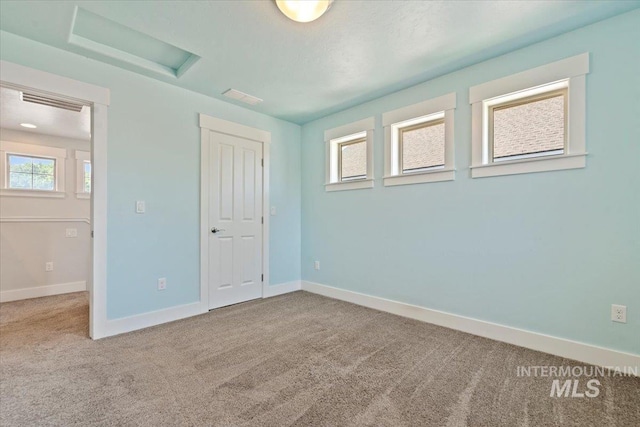 924 E Wright St, Boise, ID 83706 - unfurnished bedroom featuring attic access, carpet, and a closet