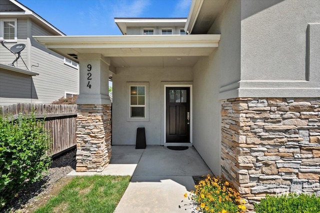 924 E Wright St, Boise, ID 83706 - doorway to property featuring stone siding and stucco siding