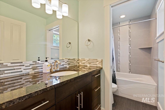 924 E Wright St, Boise, ID 83706 - bathroom with vanity, shower / bath combo with shower curtain, decorative backsplash, and a chandelier